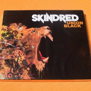 Skindred - Union Black (CD + DVD, dientes rotos del soporte del disco)